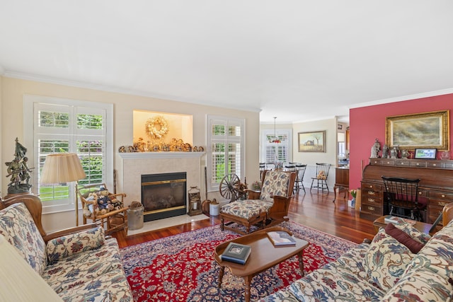 250 Mere Point Rd, Brunswick, ME 04011 - living room featuring a fireplace with flush hearth, crown molding, wood finished floors, and healthy amount of natural light
