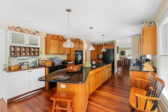 250 Mere Point Rd, Brunswick, ME 04011 - kitchen featuring oven, dark countertops, dark wood-style floors, a center island, and gas stovetop