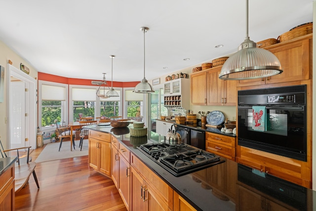 250 Mere Point Rd, Brunswick, ME 04011 - kitchen with black appliances, dark countertops, light wood finished floors, pendant lighting, and recessed lighting