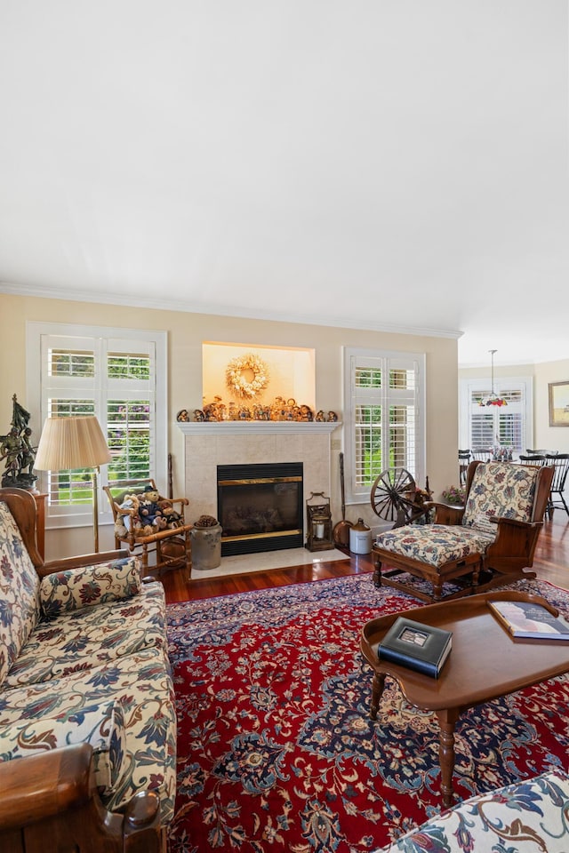250 Mere Point Rd, Brunswick, ME 04011 - living area featuring ornamental molding, a fireplace with flush hearth, and wood finished floors