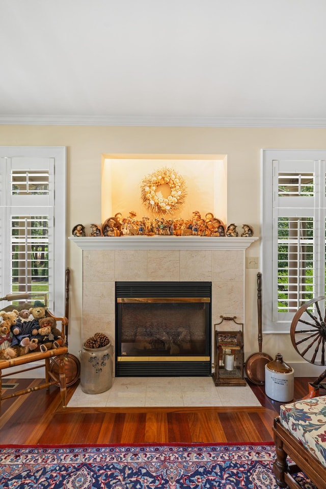 250 Mere Point Rd, Brunswick, ME 04011 - detailed view of a fireplace, crown molding, and wood finished floors