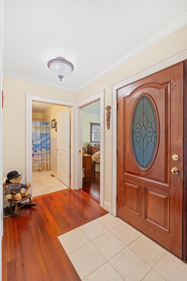 250 Mere Point Rd, Brunswick, ME 04011 - foyer featuring ornamental molding and light wood-style flooring