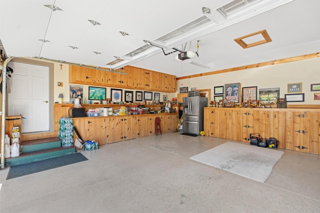 250 Mere Point Rd, Brunswick, ME 04011 - garage with stainless steel fridge with ice dispenser and a garage door opener