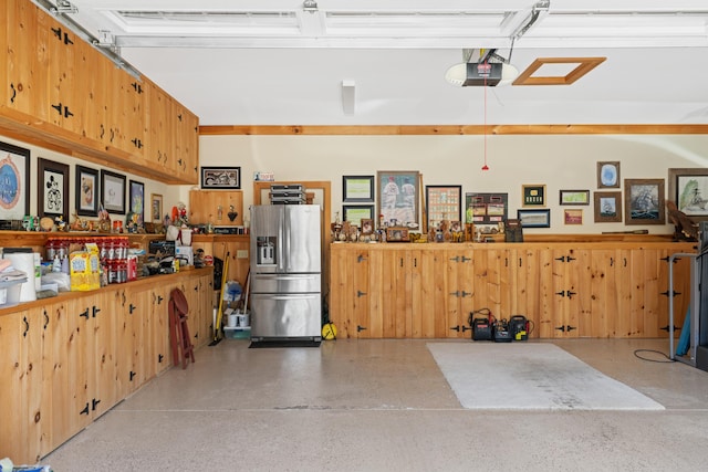 250 Mere Point Rd, Brunswick, ME 04011 - garage with stainless steel fridge and a garage door opener