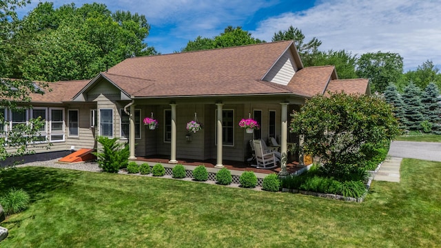 250 Mere Point Rd, Brunswick, ME 04011 - view of front of property featuring a front yard, a porch, and a shingled roof