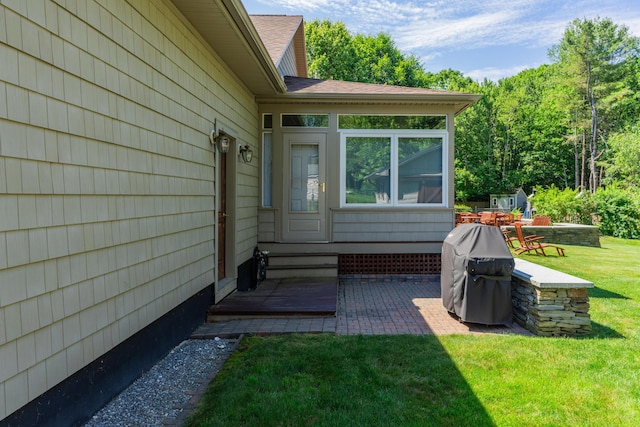 250 Mere Point Rd, Brunswick, ME 04011 - property entrance featuring a lawn, a patio area, and a shingled roof