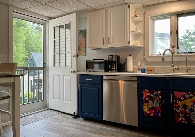10 Aegis Dr Unit B, Bath, ME 04530 - kitchen featuring stainless steel appliances, blue cabinets, open shelves, light countertops, and a paneled ceiling