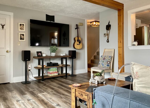 10 Aegis Dr Unit B, Bath, ME 04530 - living room featuring wood finished floors, stairway, and a textured ceiling
