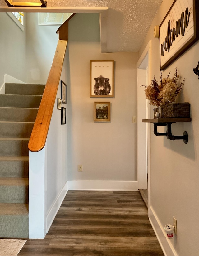 10 Aegis Dr Unit B, Bath, ME 04530 - stairway with wood finished floors and a textured ceiling