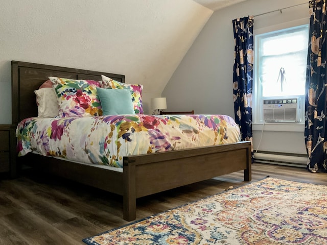 10 Aegis Dr Unit B, Bath, ME 04530 - bedroom with wood finished floors, baseboard heating, cooling unit, and vaulted ceiling