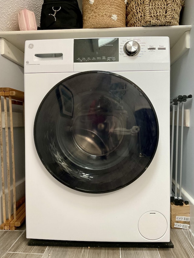 10 Aegis Dr Unit B, Bath, ME 04530 - laundry area with washer / clothes dryer and wood finished floors