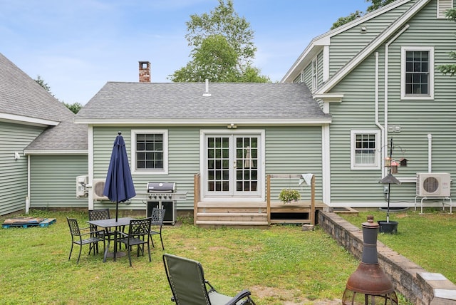 3729 Union St, Levant, ME 04456 - back of property with a shingled roof, french doors, a yard, and a chimney