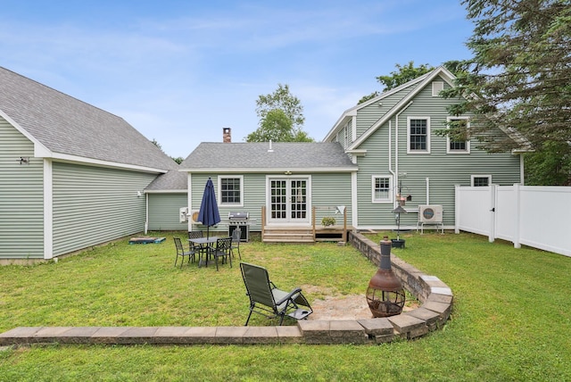 3729 Union St, Levant, ME 04456 - rear view of house featuring a fire pit, french doors, a shingled roof, entry steps, and a chimney