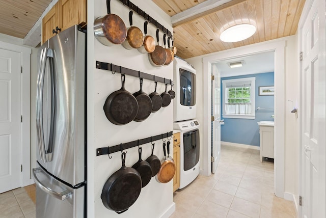 3729 Union St, Levant, ME 04456 - laundry area with wooden ceiling, stacked washer / drying machine, and light tile patterned floors
