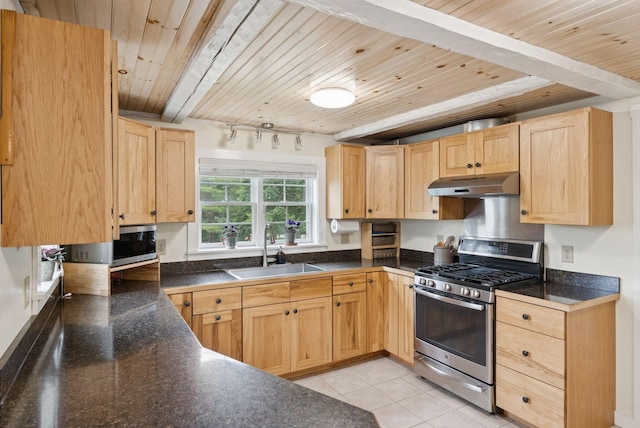 3729 Union St, Levant, ME 04456 - kitchen with appliances with stainless steel finishes, a wooden ceiling with exposed beams, light brown cabinetry, and dark countertops