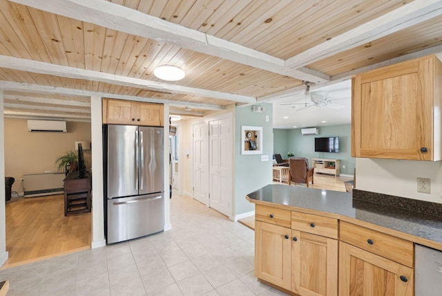 3729 Union St, Levant, ME 04456 - kitchen with freestanding refrigerator, dark countertops, a wooden ceiling with exposed beams, light brown cabinets, and a desk