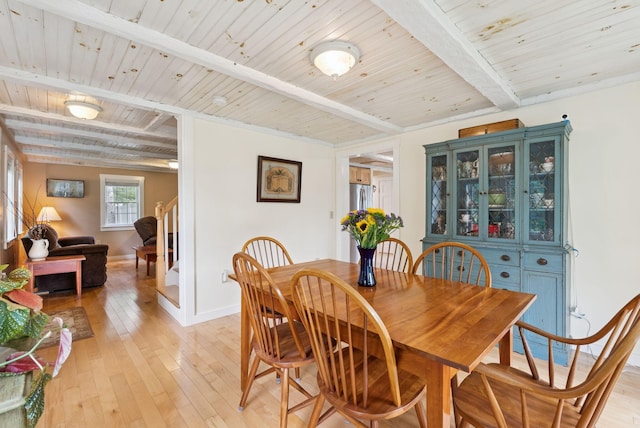 3729 Union St, Levant, ME 04456 - dining area with a wood ceiling with exposed beams, light wood-style flooring, and stairway