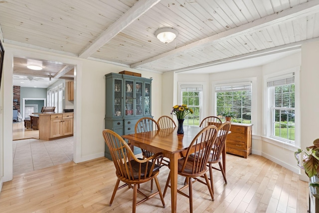 3729 Union St, Levant, ME 04456 - dining room featuring light wood-style floors and beamed ceiling