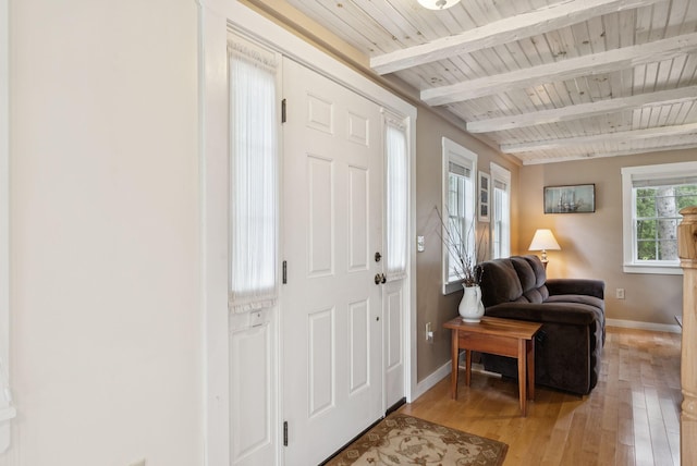 3729 Union St, Levant, ME 04456 - foyer with light wood-style flooring and a wood ceiling with exposed beams