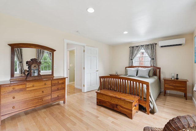 3729 Union St, Levant, ME 04456 - bedroom with multiple windows, light wood-style flooring, recessed lighting, and a wall mounted air conditioner