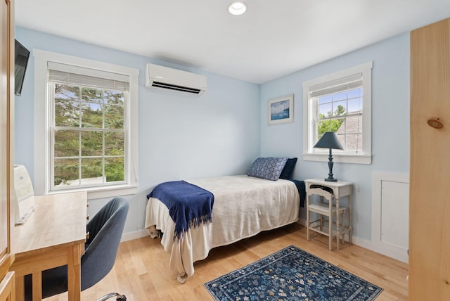 3729 Union St, Levant, ME 04456 - bedroom featuring light wood finished floors and a wall mounted AC
