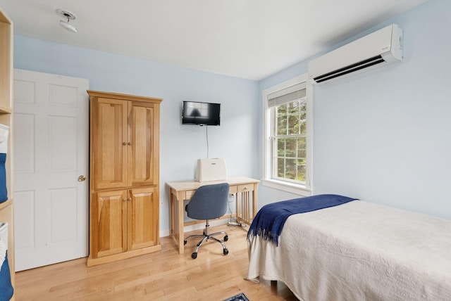 3729 Union St, Levant, ME 04456 - bedroom with light wood-style flooring, a wall unit AC, and an office area