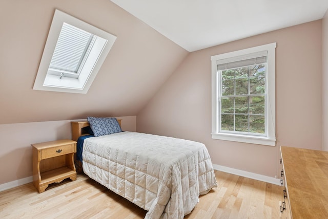 3729 Union St, Levant, ME 04456 - bedroom featuring a skylight, light wood-style floors, and lofted ceiling