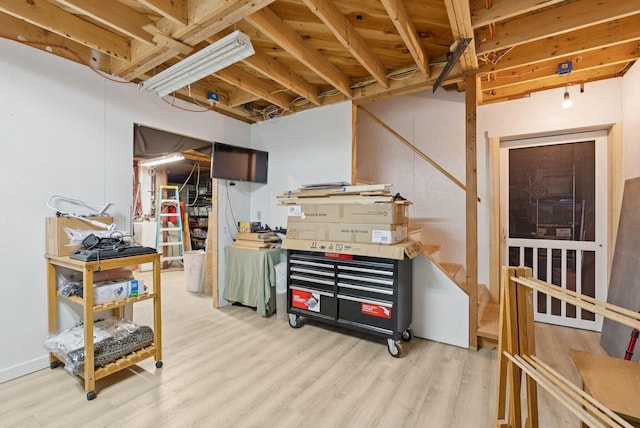 3729 Union St, Levant, ME 04456 - unfinished below grade area with wood finished floors and a workshop area