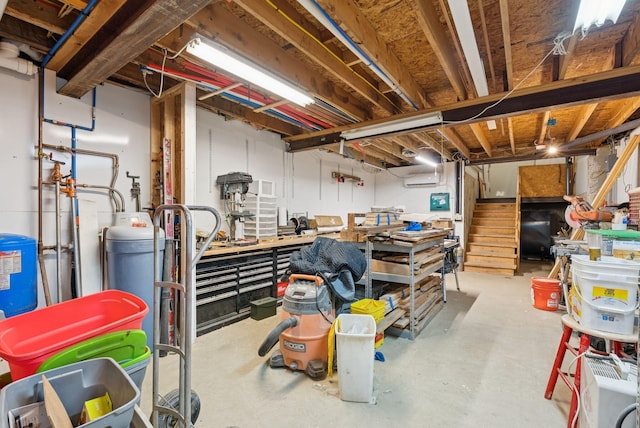 3729 Union St, Levant, ME 04456 - unfinished below grade area featuring a workshop area, a water pressure tank, oil tank, and stairway