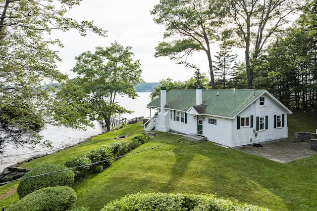 28 Will Alley Rd, South Bristol, ME 04568 - rear view of property with a chimney, a water view, and a lawn
