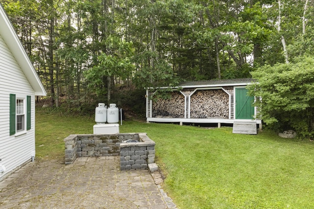 28 Will Alley Rd, South Bristol, ME 04568 - view of grassy yard featuring a patio area and a storage unit