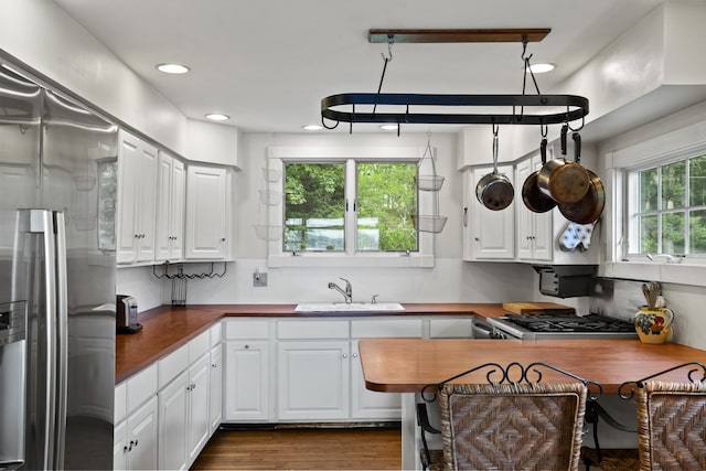 28 Will Alley Rd, South Bristol, ME 04568 - kitchen with stainless steel fridge, white cabinetry, wooden counters, dark wood-style flooring, and recessed lighting