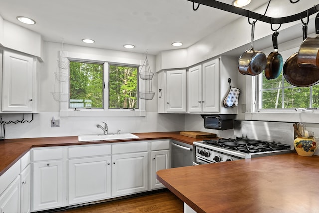 28 Will Alley Rd, South Bristol, ME 04568 - kitchen featuring appliances with stainless steel finishes, white cabinets, recessed lighting, and wood counters