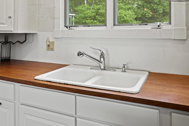 28 Will Alley Rd, South Bristol, ME 04568 - kitchen featuring white cabinets and dark countertops