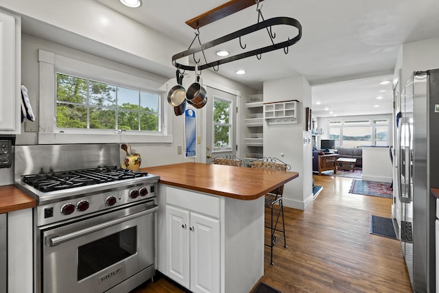 28 Will Alley Rd, South Bristol, ME 04568 - kitchen featuring appliances with stainless steel finishes, wooden counters, open floor plan, white cabinetry, and recessed lighting