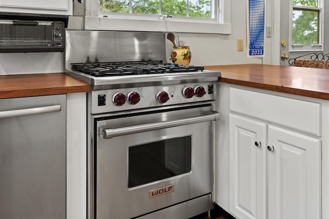 28 Will Alley Rd, South Bristol, ME 04568 - kitchen with butcher block counters, stainless steel appliances, and healthy amount of natural light