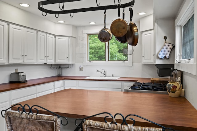 28 Will Alley Rd, South Bristol, ME 04568 - kitchen featuring wooden counters, white cabinetry, and recessed lighting