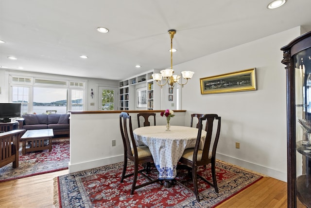 28 Will Alley Rd, South Bristol, ME 04568 - dining area featuring a chandelier, recessed lighting, wood finished floors, and a water view