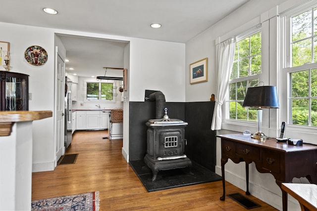 28 Will Alley Rd, South Bristol, ME 04568 - interior space with a wood stove, healthy amount of natural light, light wood-style flooring, and recessed lighting