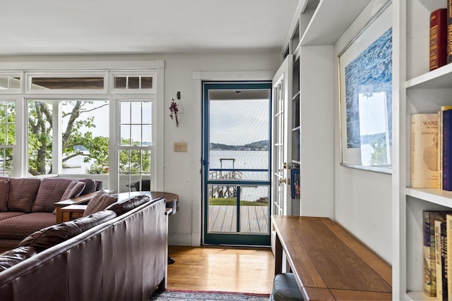28 Will Alley Rd, South Bristol, ME 04568 - doorway to outside featuring healthy amount of natural light, wood finished floors, and a water view