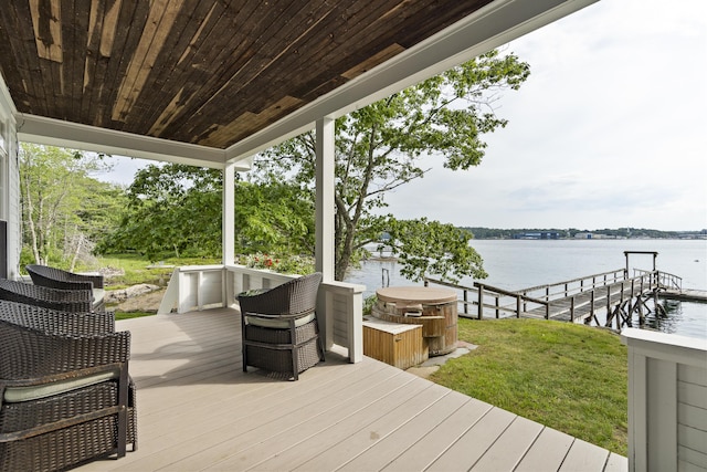 28 Will Alley Rd, South Bristol, ME 04568 - wooden deck with a water view, a lawn, a dock, and a hot tub