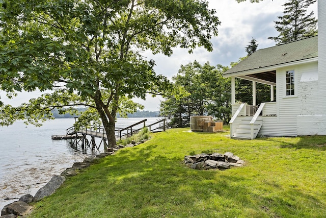28 Will Alley Rd, South Bristol, ME 04568 - view of green lawn featuring an outdoor fire pit, a water view, stairs, and a boat dock
