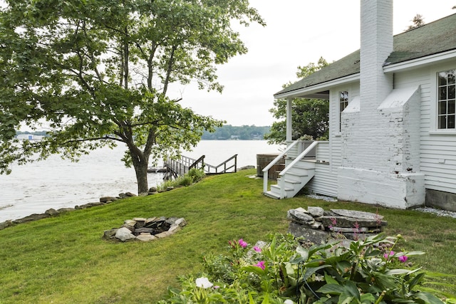 28 Will Alley Rd, South Bristol, ME 04568 - view of green lawn featuring an outdoor fire pit and a water view