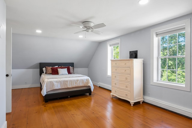 253 Quaker Meeting House Rd, Durham, ME 04222 - bedroom with baseboard heating, a baseboard radiator, light wood finished floors, vaulted ceiling, and ceiling fan