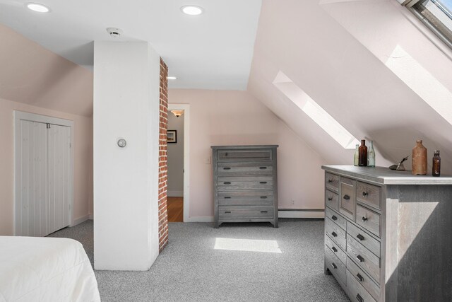 253 Quaker Meeting House Rd, Durham, ME 04222 - bedroom featuring a skylight, a baseboard heating unit, vaulted ceiling, light carpet, and recessed lighting