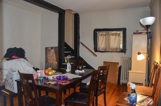 40 Chapel St, Augusta, ME 04330 - dining space with radiator, wood finished floors, stairway, and ornamental molding