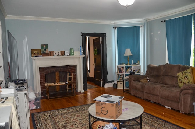 40 Chapel St, Augusta, ME 04330 - living room with wood finished floors, crown molding, and a fireplace