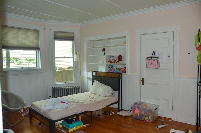 40 Chapel St, Augusta, ME 04330 - bedroom with radiator heating unit, wood finished floors, ornamental molding, wainscoting, and a decorative wall