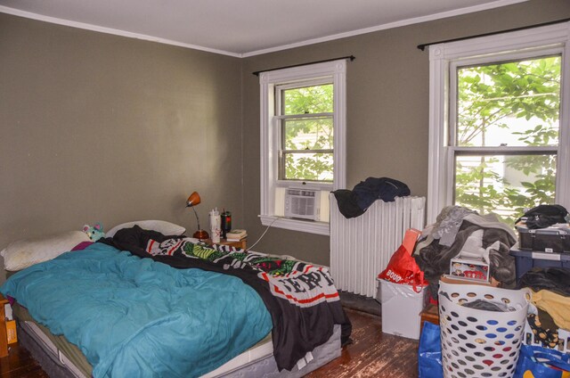 40 Chapel St, Augusta, ME 04330 - bedroom featuring radiator heating unit, wood finished floors, and ornamental molding