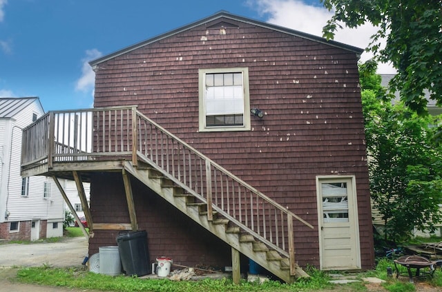 40 Chapel St, Augusta, ME 04330 - rear view of property with stairway, a deck, and an outdoor fire pit